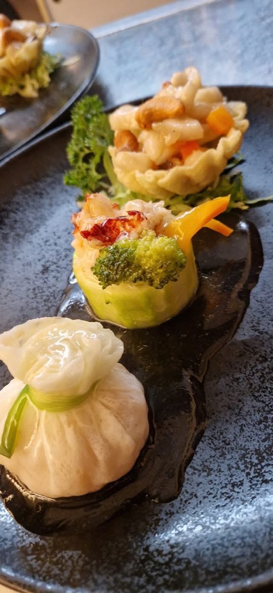Dim sum trio op een leisteen bord